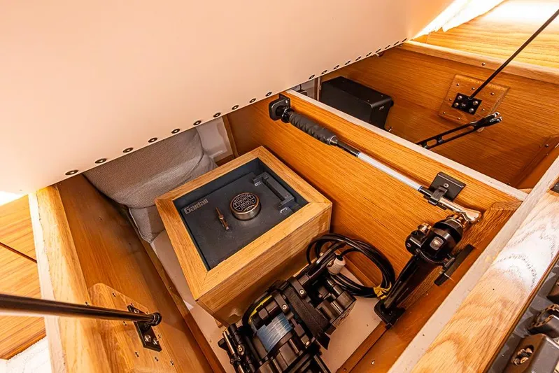 Big Stink Yacht Photos Pics Hidden compartment in 2026 Viking 54 Convertible yacht with secure safe and equipment.