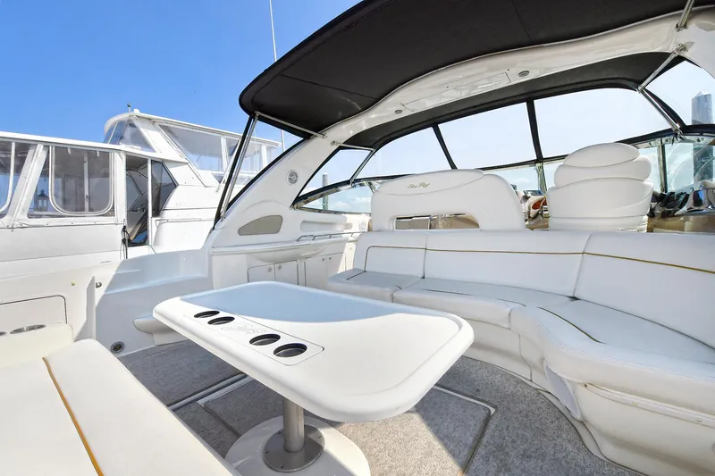  Yacht Photos Pics Luxurious 2000 Sea Ray 460 Sundancer yacht interior with white seating and table.