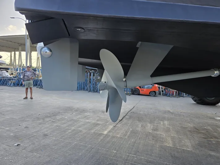 Triple Net II Yacht Photos Pics Propeller and rudder of 1994 Hatteras 82 Convertible yacht on dry dock.