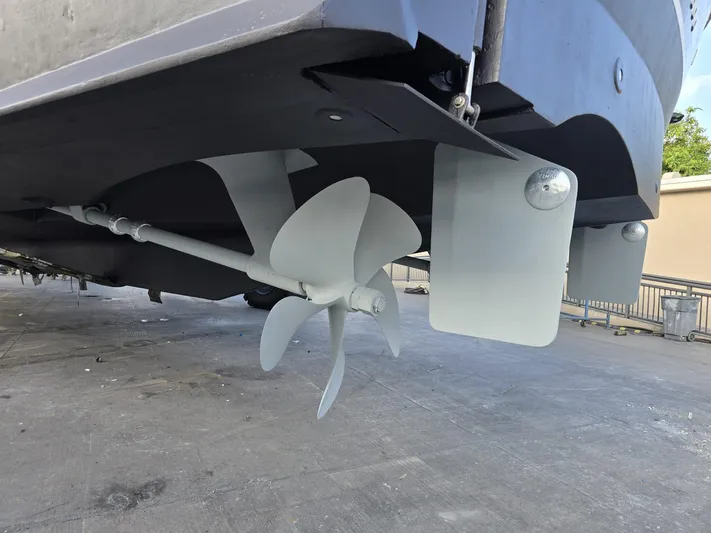 Triple Net II Yacht Photos Pics Propeller and rudder of 1994 Hatteras 82 Convertible yacht on dry dock.