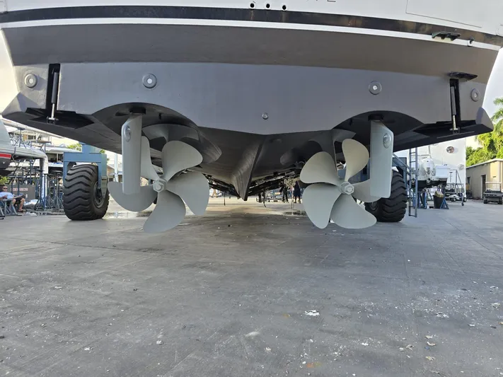 Triple Net II Yacht Photos Pics Underside view of 1994 Hatteras 82 Convertible yacht with dual propellers.