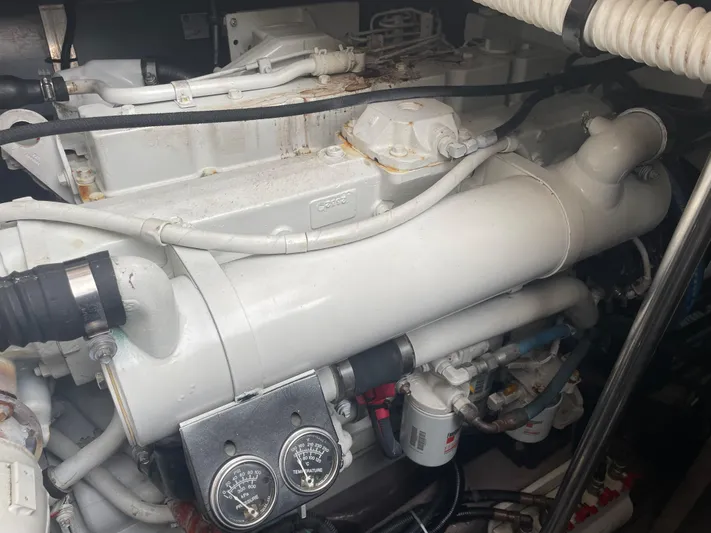 Lisa Ann Yacht Photos Pics Engine compartment of a 2003 Sea Ray 460 Sundancer boat, showing mechanical components and gauges.