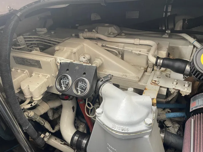 Lisa Ann Yacht Photos Pics Engine compartment of a 2003 Sea Ray 460 Sundancer boat, showing gauges and mechanical components.