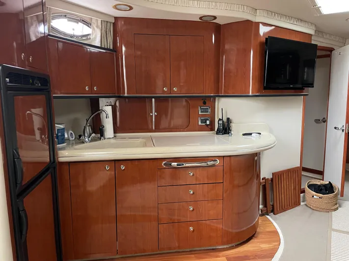 Lisa Ann Yacht Photos Pics Luxurious 2003 Sea Ray 460 Sundancer yacht interior with elegant wooden cabinetry and modern amenities.