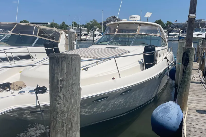 Lisa Ann Yacht Photos Pics 2003 Sea Ray 460 Sundancer yacht docked at a marina on a sunny day.