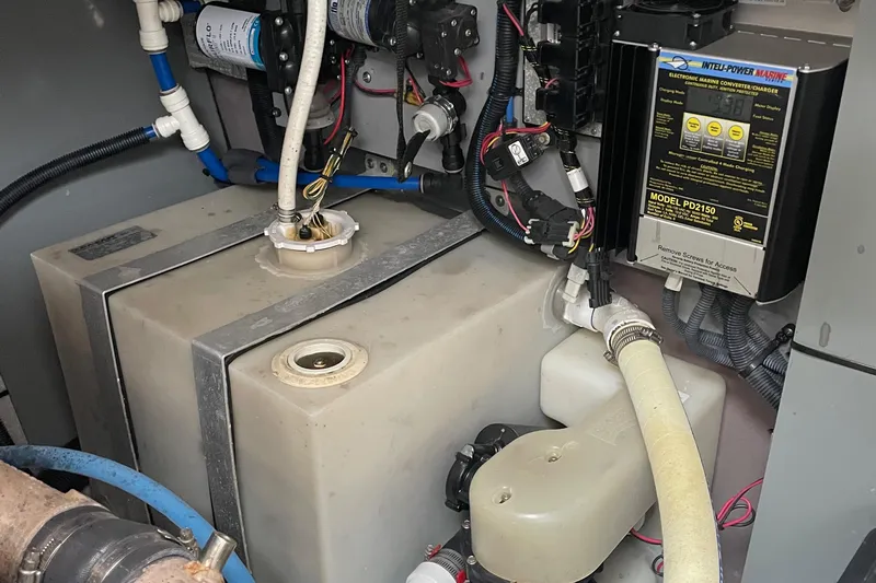 Lisa Ann Yacht Photos Pics Engine compartment of a 2003 Sea Ray 460 Sundancer with marine equipment and wiring.