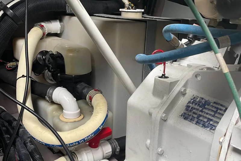 Lisa Ann Yacht Photos Pics Engine compartment of a 2003 Sea Ray 460 Sundancer with hoses and components.