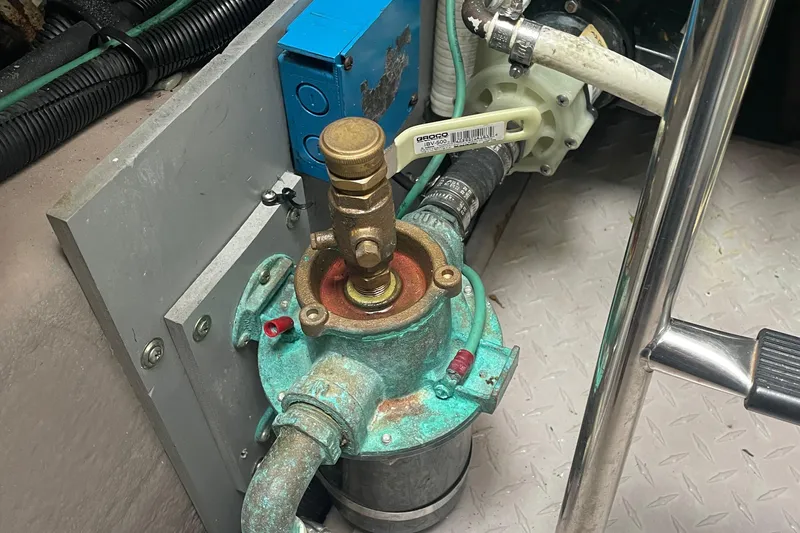 Lisa Ann Yacht Photos Pics Engine room of 2003 Sea Ray 460 Sundancer with visible pump and piping.