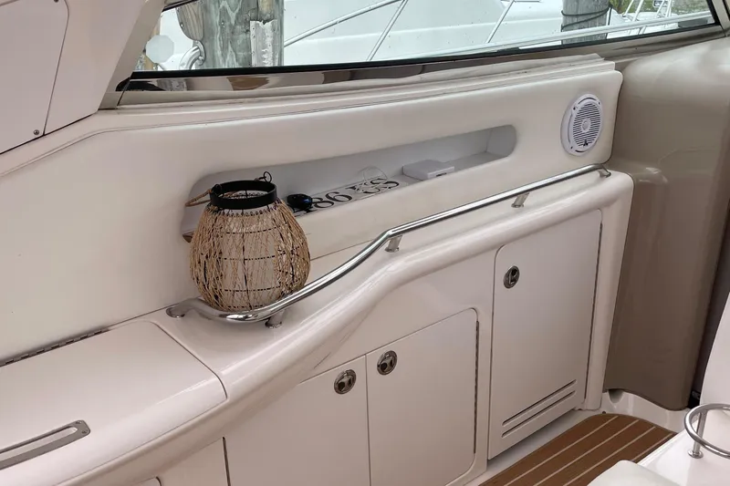 Lisa Ann Yacht Photos Pics Interior of 2003 Sea Ray 460 Sundancer yacht with storage cabinets and decorative lantern.
