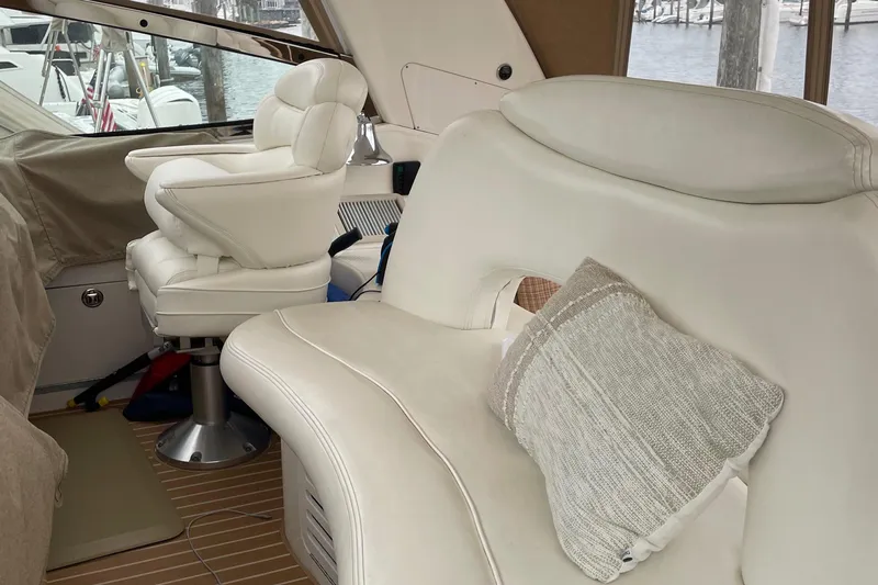 Lisa Ann Yacht Photos Pics Interior of 2003 Sea Ray 460 Sundancer with white leather seating and cushion.