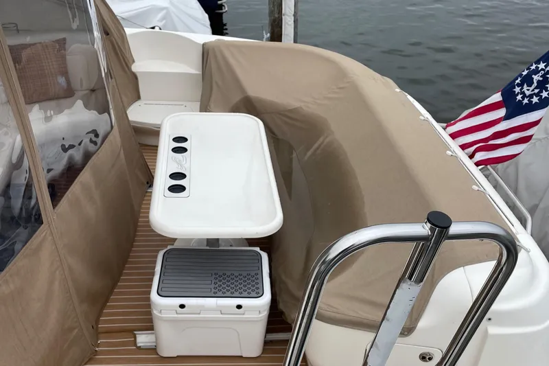 Lisa Ann Yacht Photos Pics 2003 Sea Ray 460 Sundancer boat deck with seating and American flag.