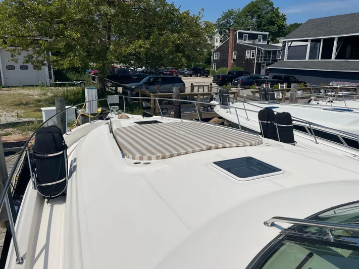 Lisa Ann Yacht Photos Pics 2003 Sea Ray 460 Sundancer yacht docked, featuring a sunpad and sleek design.