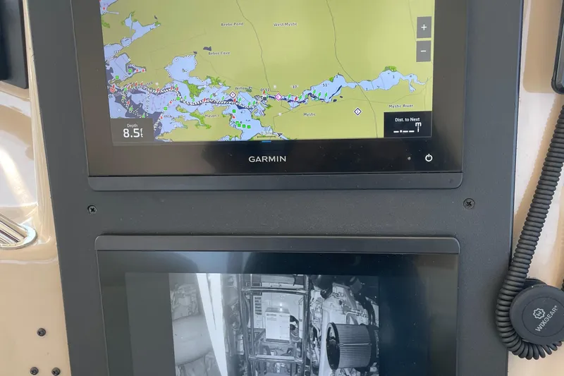 Lisa Ann Yacht Photos Pics Garmin navigation display on 2003 Sea Ray 460 Sundancer, showing map and engine monitor.