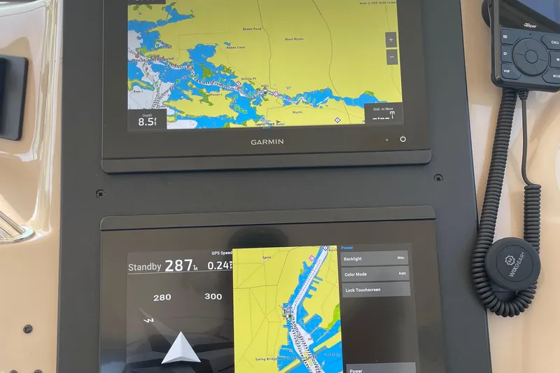 Lisa Ann Yacht Photos Pics Garmin navigation screens on a 2003 Sea Ray 460 Sundancer boat dashboard.