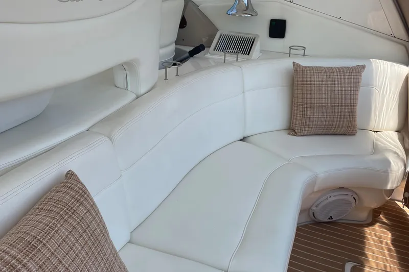 Lisa Ann Yacht Photos Pics Luxurious white seating area on 2003 Sea Ray 460 Sundancer yacht with brown cushions.