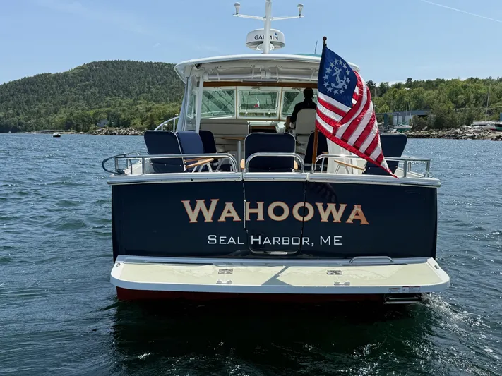 Wahoowa Yacht Photos Pics 2019 Back Cove Downeast boat "Wahoowa" in Seal Harbor, ME, with American flag.