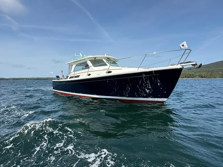 Wahoowa Yacht Photos Pics 2019 Back Cove Downeast boat cruising on open water under clear skies.