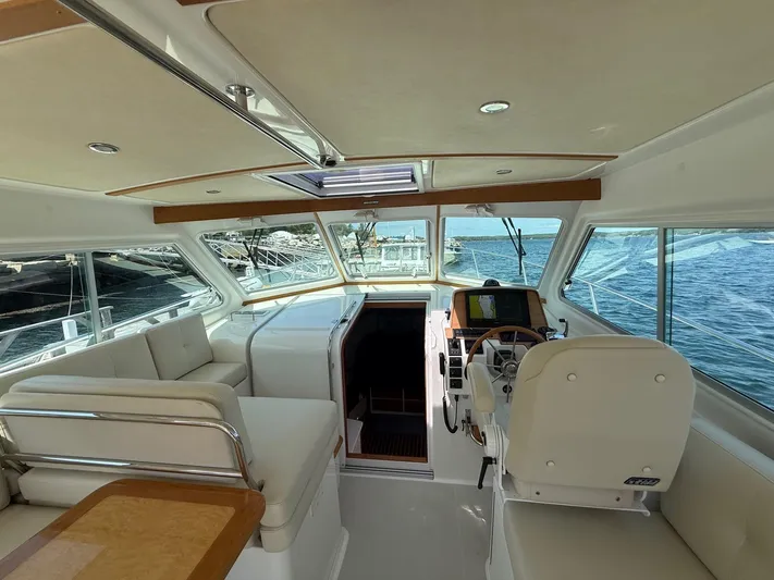 Wahoowa Yacht Photos Pics Interior of 2019 Back Cove Downeast boat with helm, seating, and ocean view.