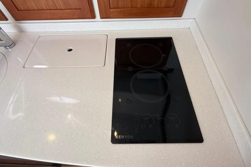 Wahoowa Yacht Photos Pics 2019 Back Cove Downeast kitchen with Kenyon cooktop and sleek countertop design.