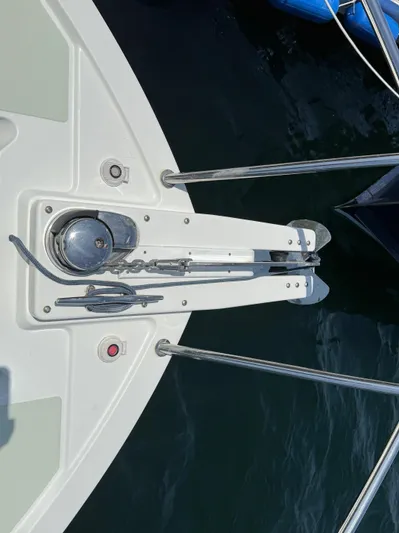 Wahoowa Yacht Photos Pics 2019 Back Cove Downeast boat bow with anchor and railing over water.