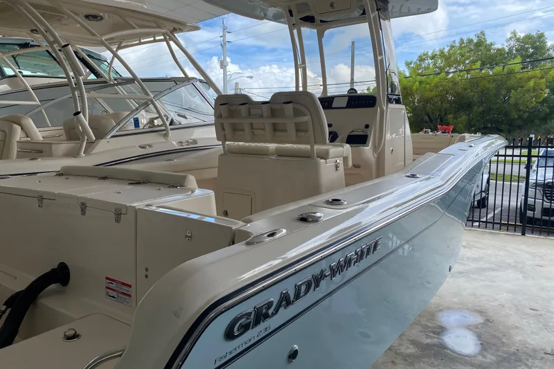  Yacht Photos Pics 2026 Grady-White Fisherman 236 boat, sleek design, spacious interior, parked in marina.