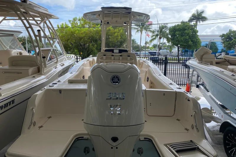  Yacht Photos Pics 2026 Grady-White Fisherman 236 boat with powerful outboard motor, docked outdoors.