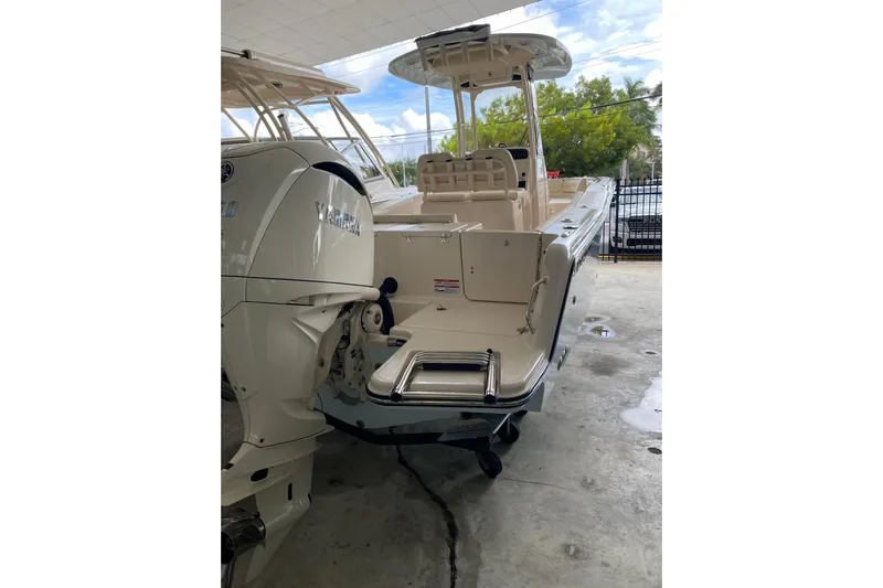  Yacht Photos Pics 2026 Grady-White Fisherman 236 boat with Yamaha engine, docked indoors.