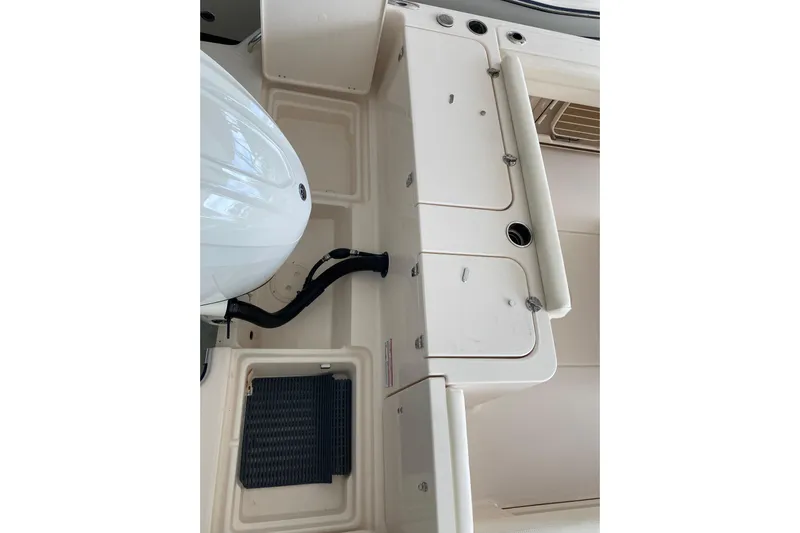  Yacht Photos Pics 2026 Grady-White Fisherman 236 boat interior, featuring storage compartments and engine area.