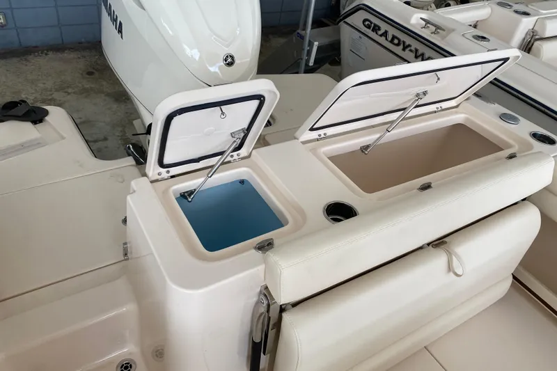  Yacht Photos Pics 2026 Grady-White Fisherman 236 boat with open storage compartments and Yamaha engine.