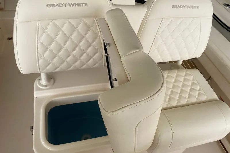  Yacht Photos Pics 2026 Grady-White Fisherman 236 boat seats with diamond stitching and storage compartment.