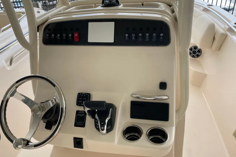  Yacht Photos Pics 2026 Grady-White Fisherman 236 boat console with steering wheel and controls.