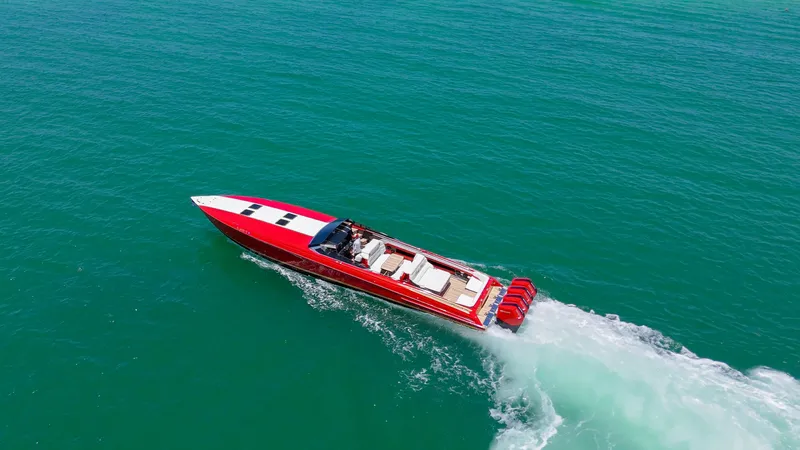Lady Lisa Yacht Photos Pics 2023 Nor-Tech 55 Flyer speedboat cruising on open water, aerial view.