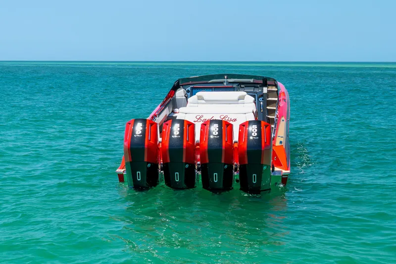 Lady Lisa Yacht Photos Pics 2023 Nor-Tech 55 Flyer boat with four powerful engines on turquoise water.