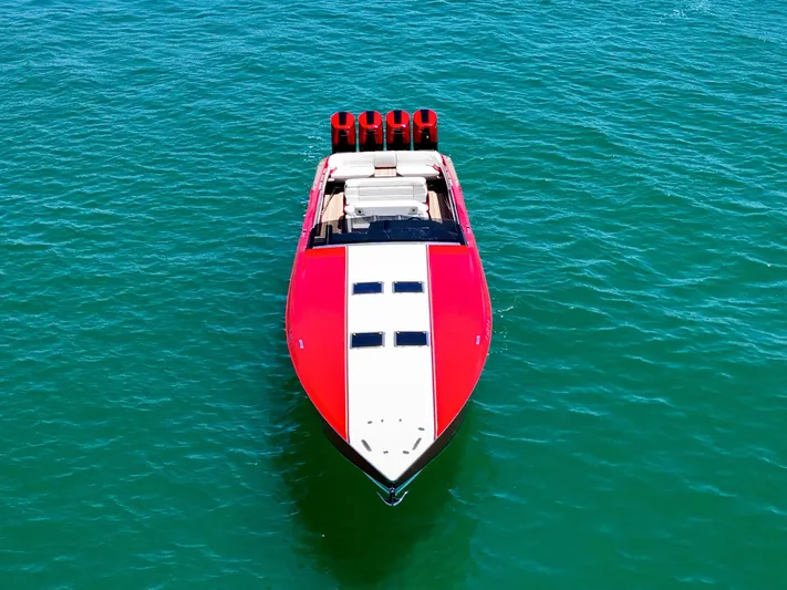Lady Lisa Yacht Photos Pics Red 2023 Nor-Tech 55 Flyer boat on clear blue water, aerial view.