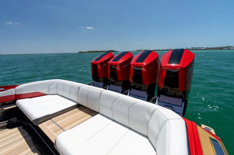 Lady Lisa Yacht Photos Pics 2023 Nor-Tech 55 Flyer boat with four powerful outboard engines on open water.