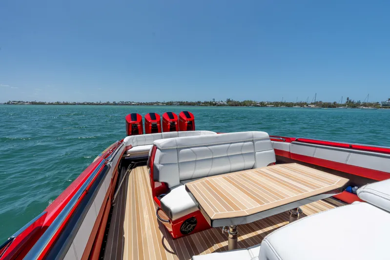 Lady Lisa Yacht Photos Pics 2023 Nor-Tech 55 Flyer boat with luxurious seating and table on open water.