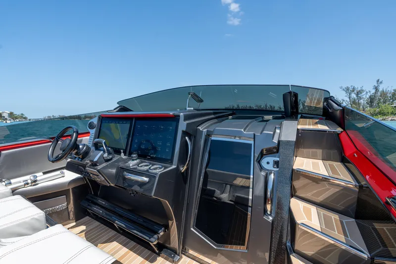 Lady Lisa Yacht Photos Pics 2023 Nor-Tech 55 Flyer cockpit with modern controls and luxurious seating.