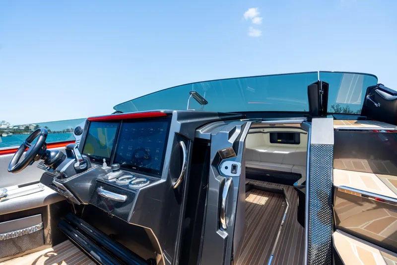 Lady Lisa Yacht Photos Pics Interior view of 2023 Nor-Tech 55 Flyer yacht cockpit with modern controls and seating.