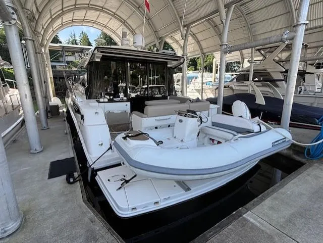 Va Bene Yacht Photos Pics 2015 Sea Ray 470 Sundancer yacht docked with inflatable boat on platform.