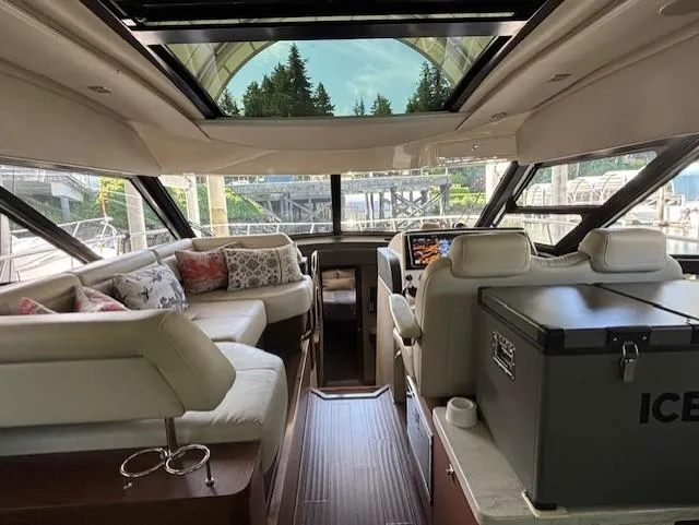 Va Bene Yacht Photos Pics Luxurious interior of 2015 Sea Ray 470 Sundancer yacht with plush seating and panoramic windows.