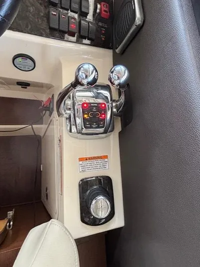 Va Bene Yacht Photos Pics 2015 Sea Ray 470 Sundancer control panel with throttle levers and navigation controls.