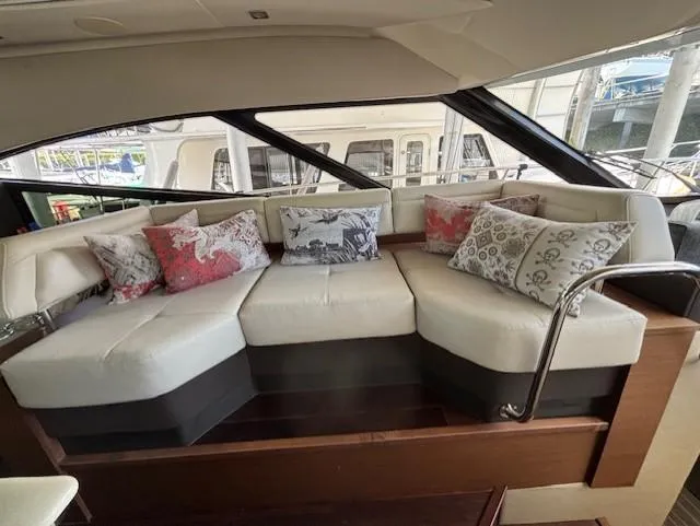 Va Bene Yacht Photos Pics Luxurious interior seating on 2015 Sea Ray 470 Sundancer yacht with decorative pillows.