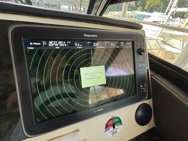 Va Bene Yacht Photos Pics Raymarine navigation system on 2015 Sea Ray 470 Sundancer yacht, displaying radar interface.