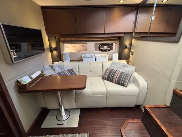Va Bene Yacht Photos Pics Luxurious interior of 2015 Sea Ray 470 Sundancer with sofa, table, and modern decor.