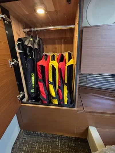 Va Bene Yacht Photos Pics Life jackets stored in a 2015 Sea Ray 470 Sundancer cabin closet.