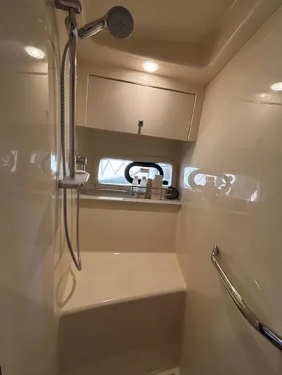 Va Bene Yacht Photos Pics Shower area in 2015 Sea Ray 470 Sundancer yacht, featuring modern fixtures and storage.