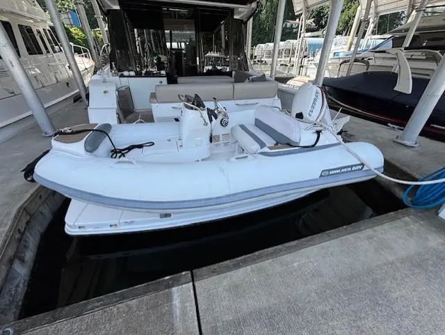 Va Bene Yacht Photos Pics 2015 Sea Ray 470 Sundancer docked with inflatable tender boat attached.