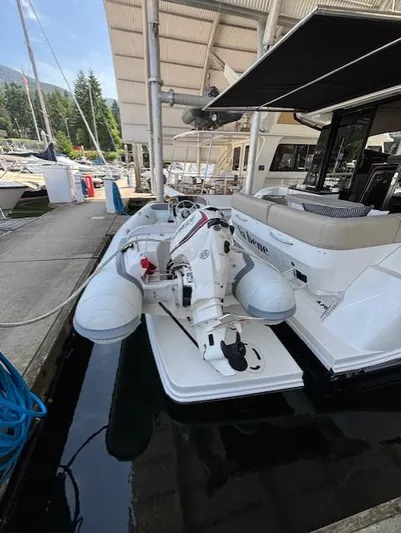 Va Bene Yacht Photos Pics 2015 Sea Ray 470 Sundancer docked with inflatable boat on platform.