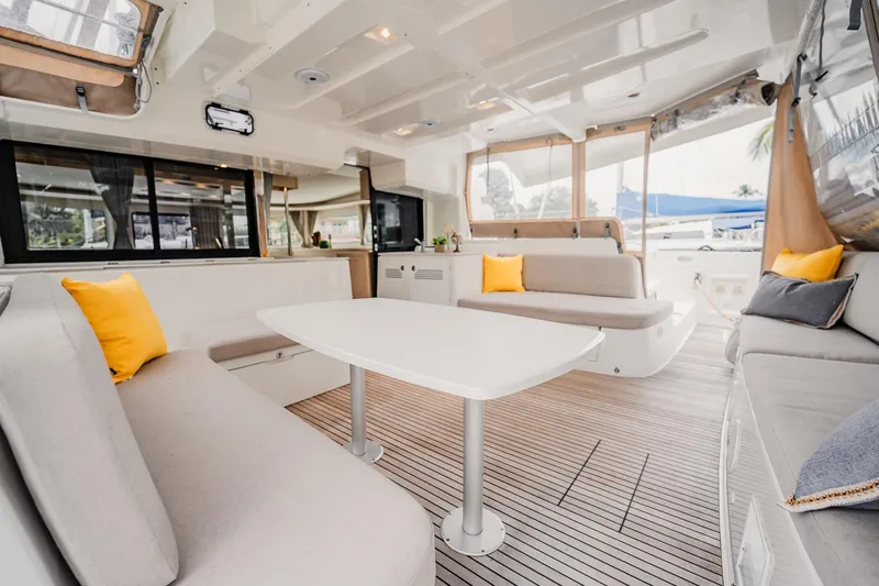  Yacht Photos Pics Luxurious interior of 2022 Lagoon 46 catamaran with modern seating and decor.