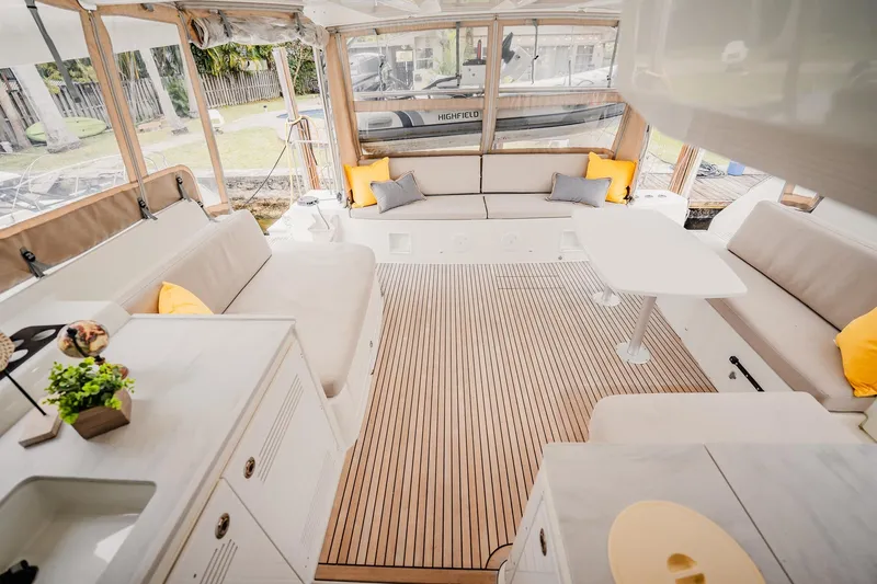  Yacht Photos Pics Luxurious interior of 2022 Lagoon 46 catamaran with elegant seating and modern decor.